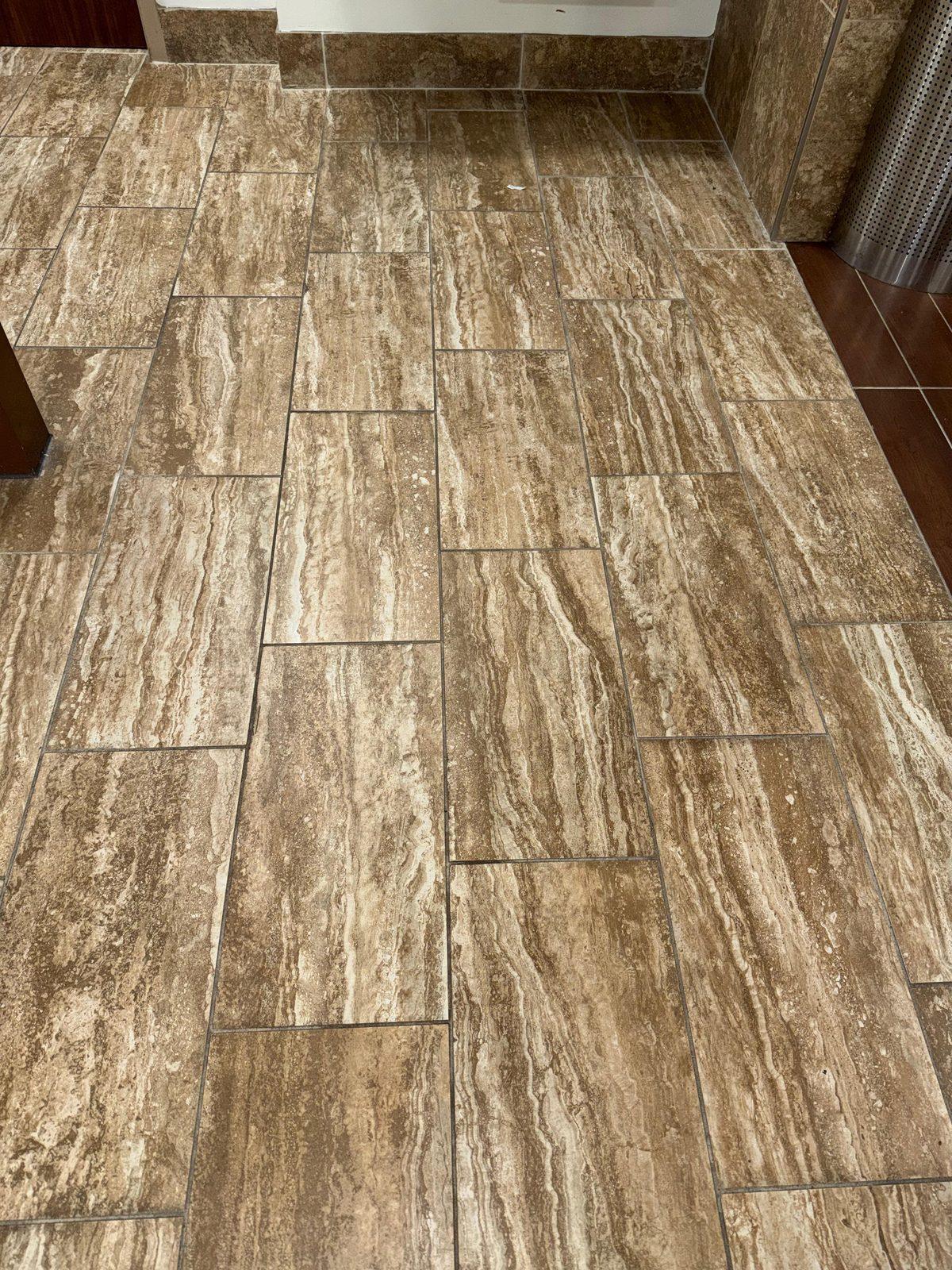 Rectangular floor tiles and grout lines in a commercial space